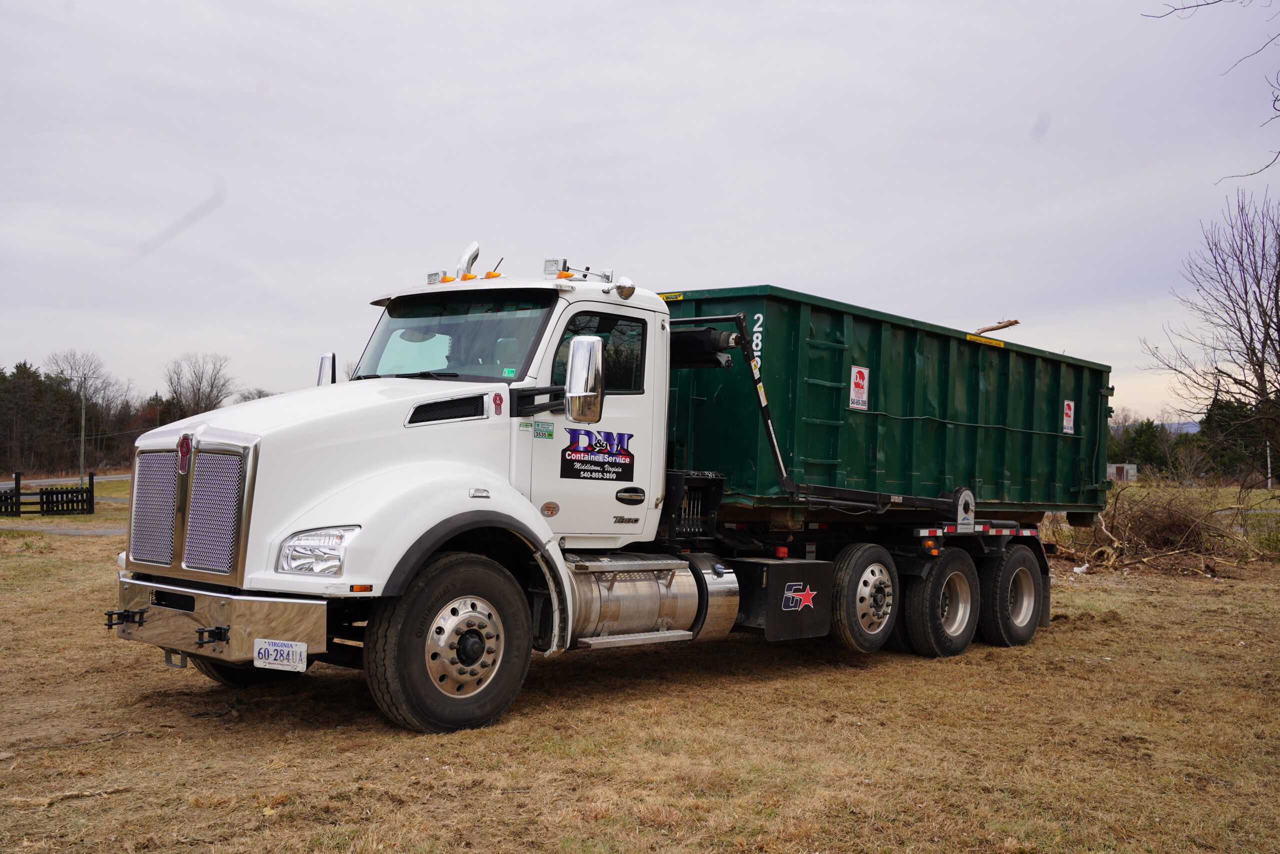 D&M Container Service Kenworth roll off truck with a green dumpster, Middletown VA